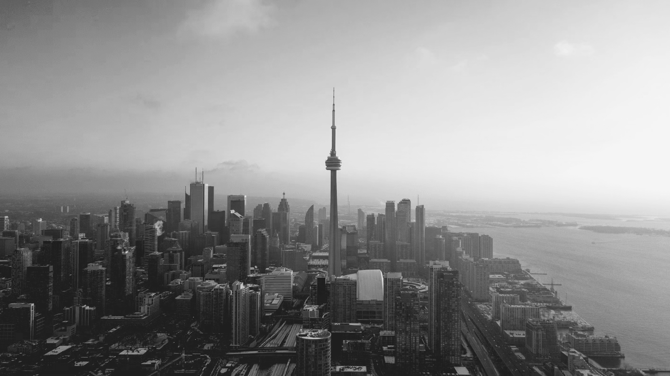 Black and white aerial view of the Toronto skyline and CN Tower
